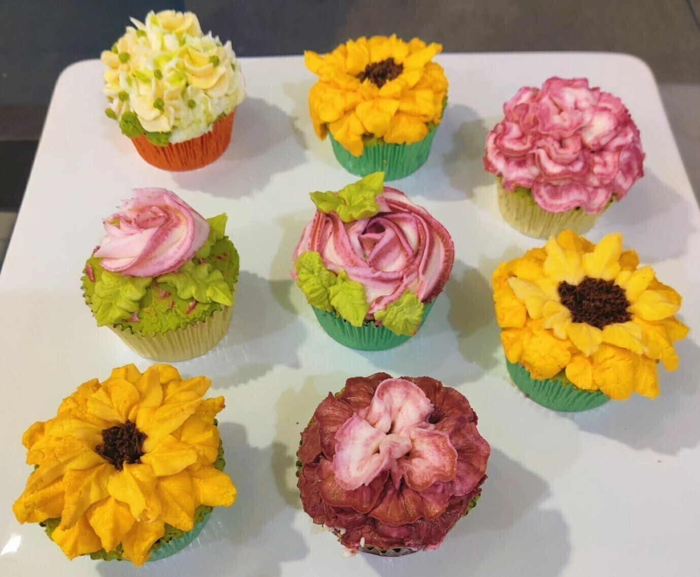 Flower themed cupcakes.